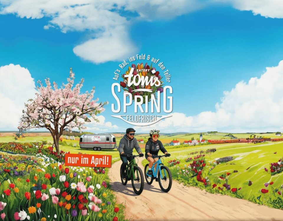 Tonis Spring: Radfahrer im blühenden Hohenloher Frühling, Aprilkarte 2026